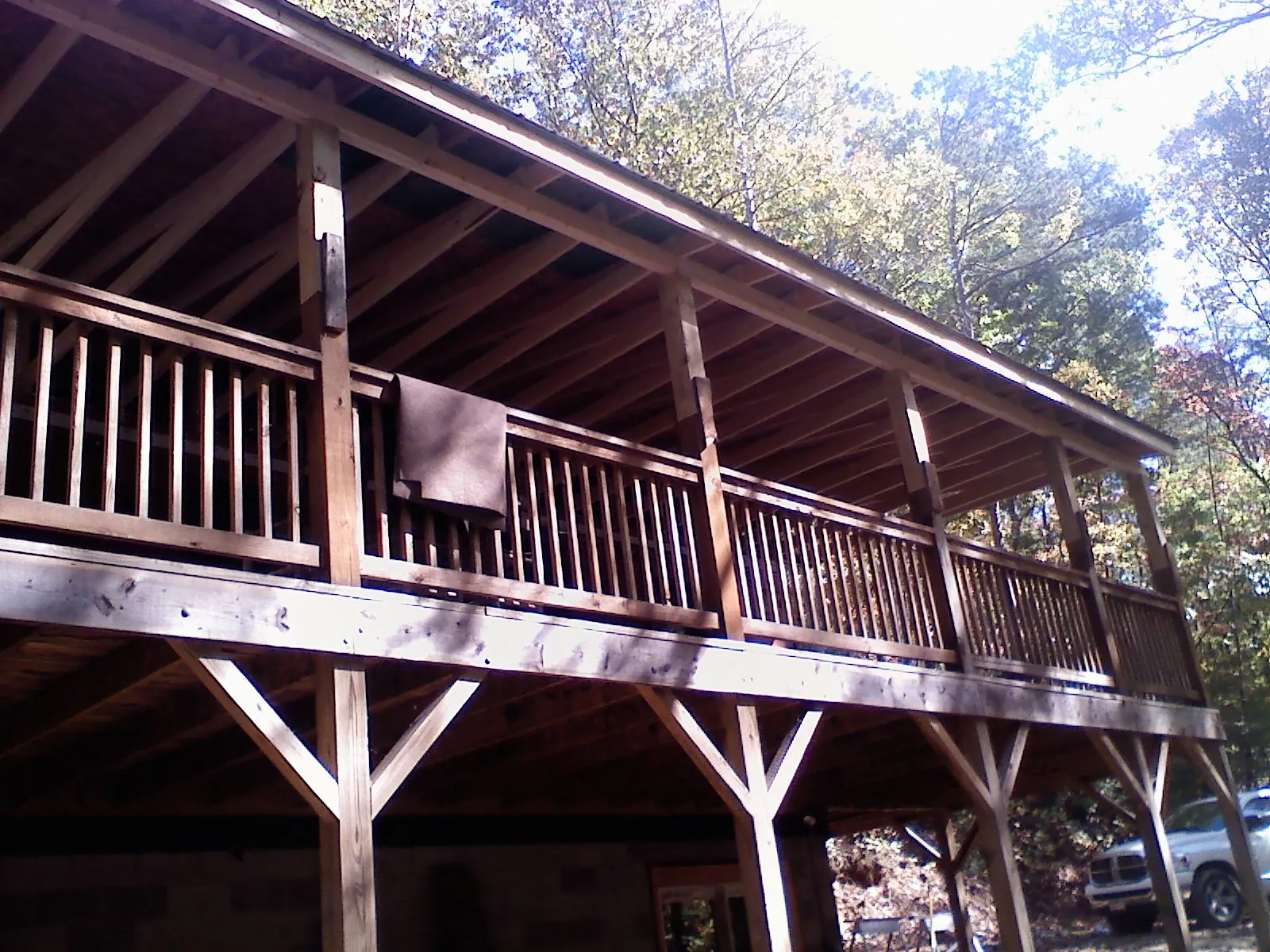 Timber framing under a new elevated porch and deck — Roof Leak Repair in Berryville by Roofing Brothers